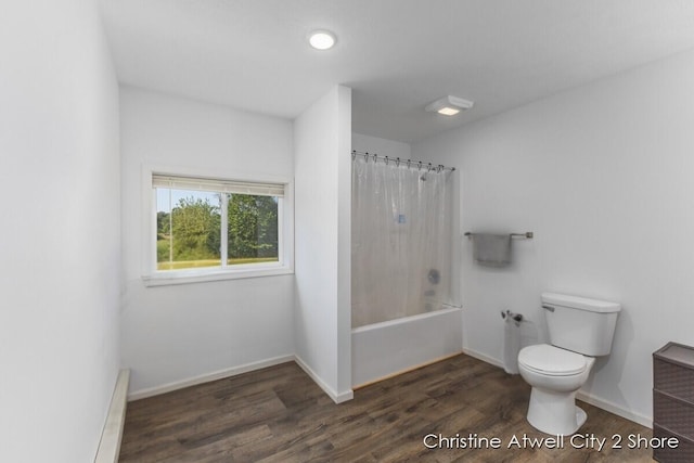 bathroom featuring toilet, wood-type flooring, and shower / bath combo