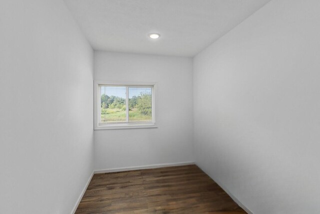 spare room featuring dark hardwood / wood-style floors