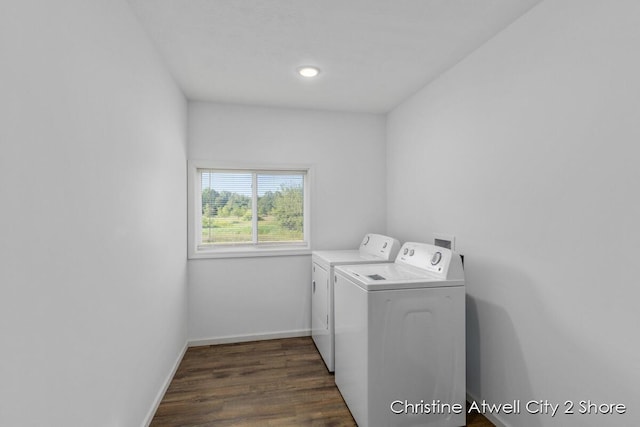 laundry area with separate washer and dryer and dark hardwood / wood-style floors