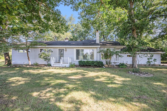 ranch-style home with a front yard