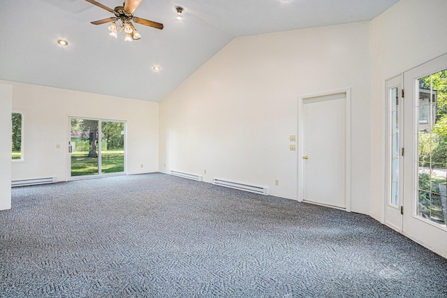 carpeted spare room featuring a baseboard heating unit, plenty of natural light, and high vaulted ceiling