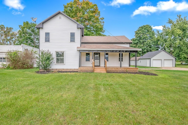 view of front of house with an outbuilding, a porch, a garage, and a front yard