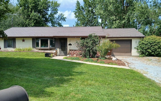 single story home featuring a front lawn and a garage