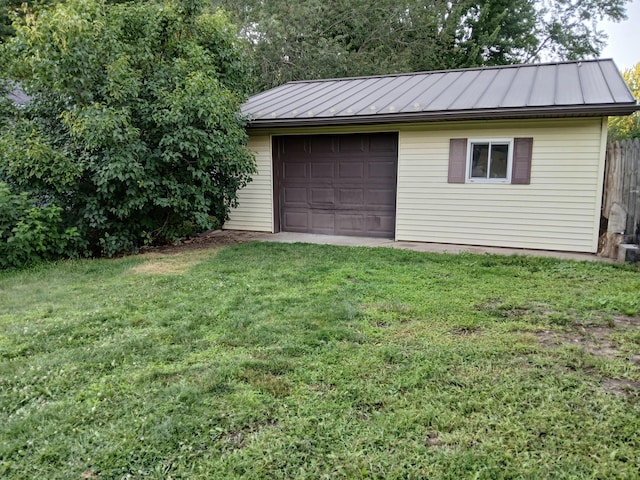 garage with a yard