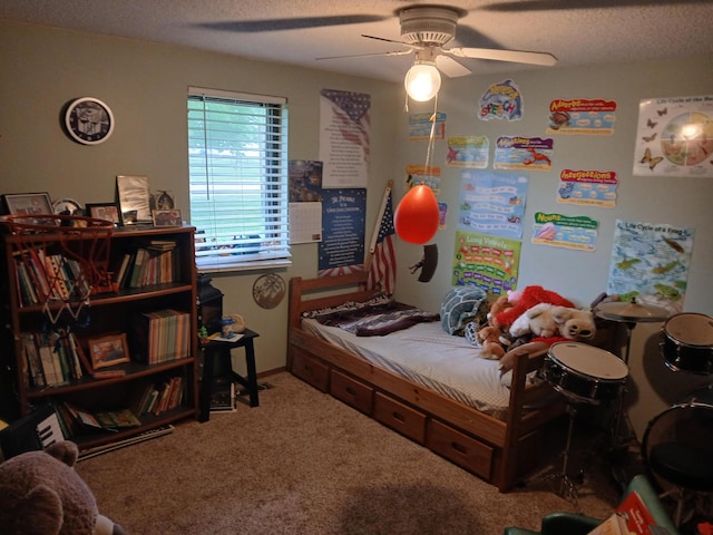 carpeted bedroom with a textured ceiling and ceiling fan