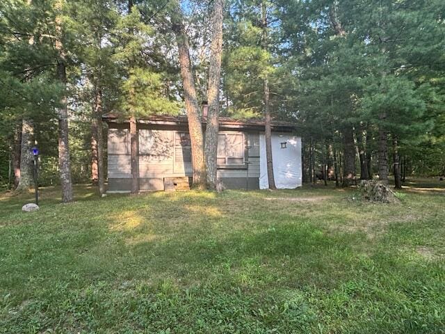 view of outdoor structure with a yard