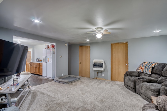 living room featuring ceiling fan and carpet