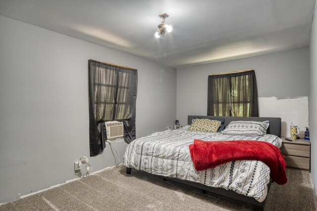 bedroom featuring carpet floors and cooling unit