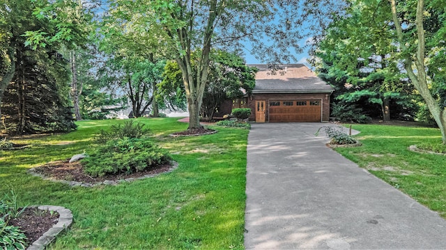 view of front facade featuring a front yard and a garage