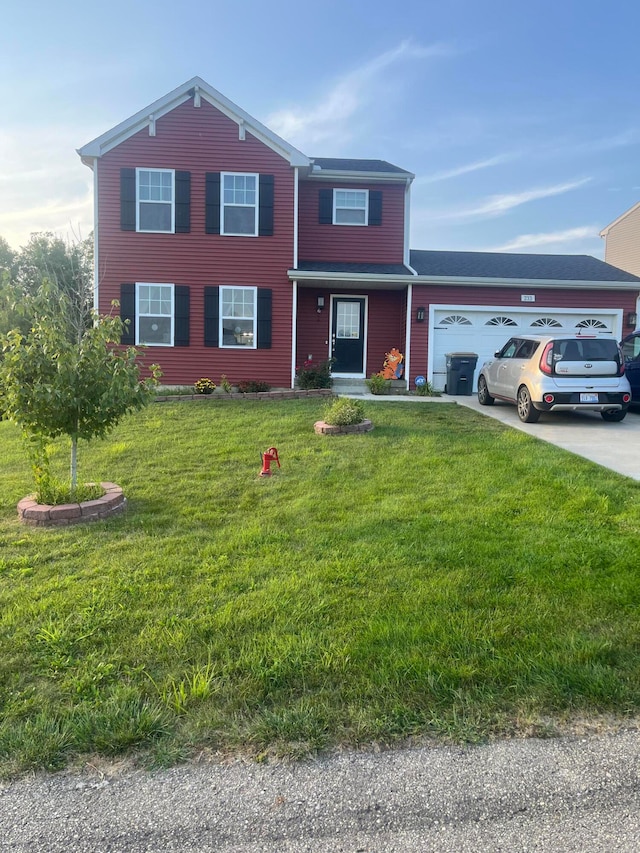 view of front facade with a garage and a front lawn