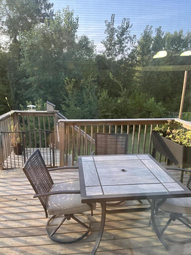 wooden deck with outdoor dining area