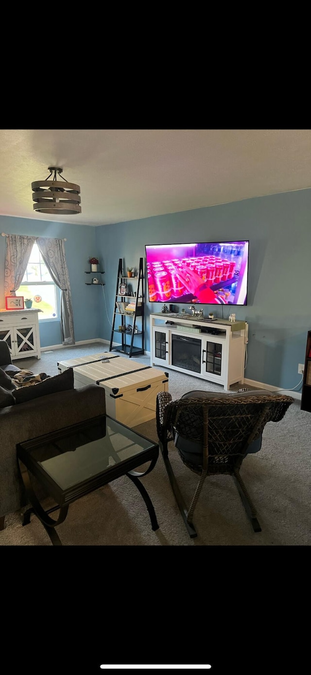 living room with baseboards and carpet floors