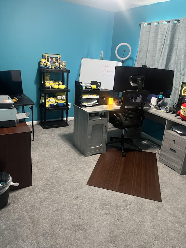 home office featuring carpet flooring and baseboards