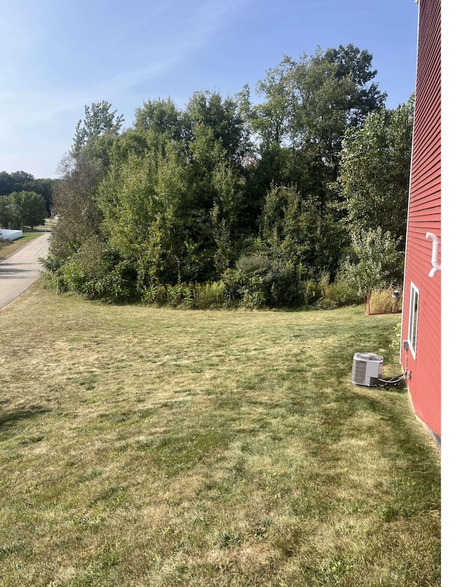 view of yard with central air condition unit