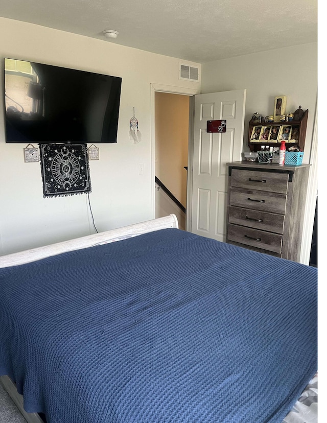 bedroom with visible vents