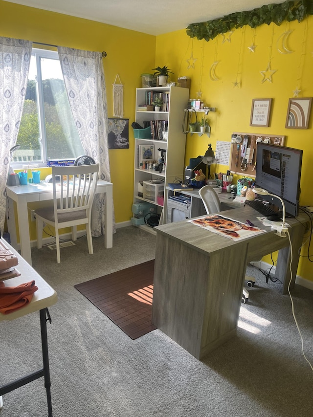 carpeted office space featuring baseboards