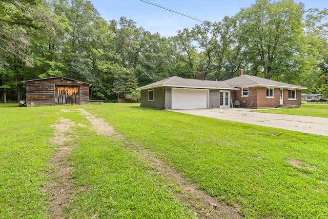 view of front of house with a front lawn and a garage