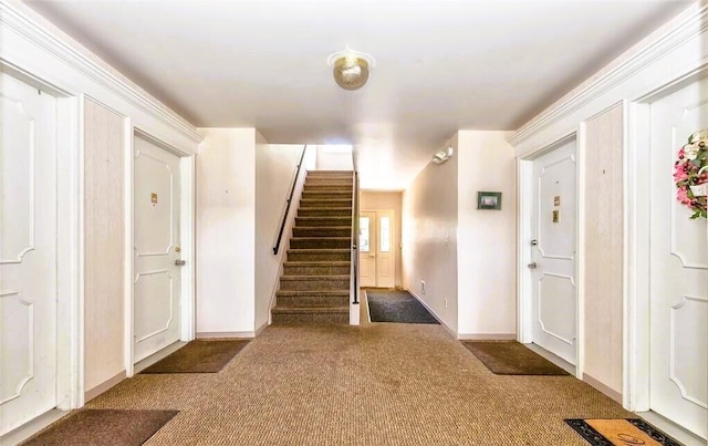 foyer with dark colored carpet