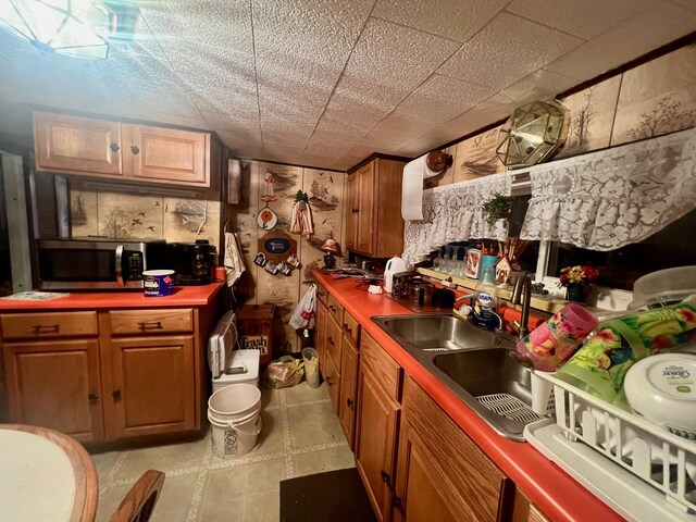 kitchen with light tile patterned flooring and sink