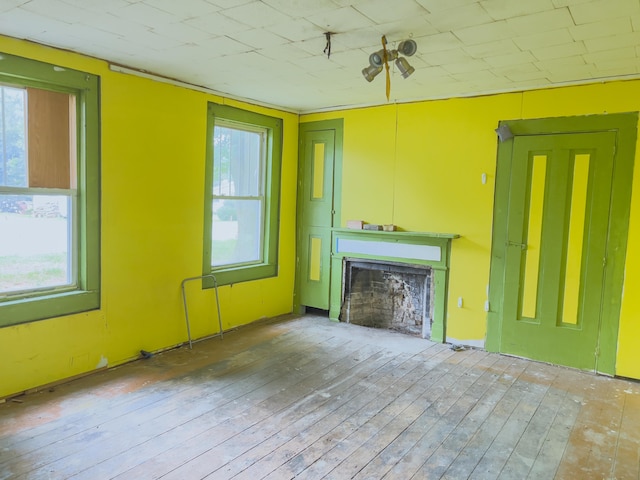 unfurnished living room featuring hardwood / wood-style flooring