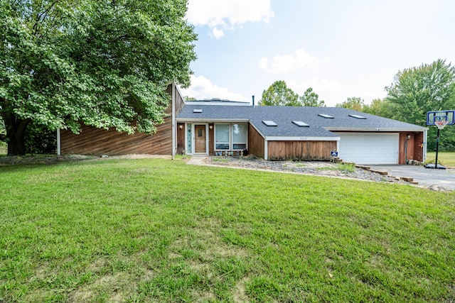 view of front of house with a garage, driveway, roof with shingles, and a front lawn