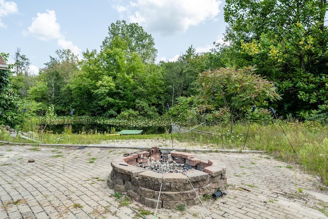 view of patio / terrace with a fire pit