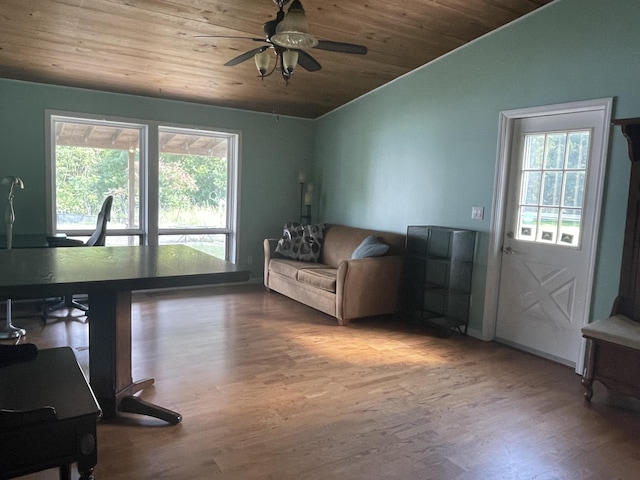 living area featuring ceiling fan, wood finished floors, wooden ceiling, and vaulted ceiling