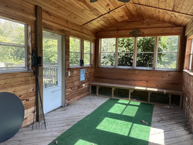 unfurnished sunroom featuring lofted ceiling and wooden ceiling