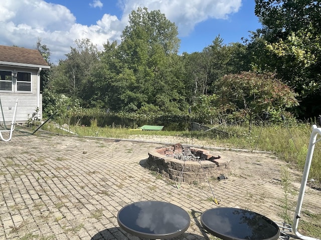 view of patio with a fire pit