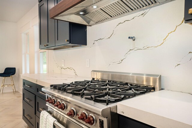 kitchen with light parquet flooring, double oven range, and custom exhaust hood