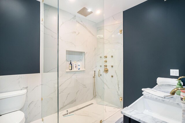 bathroom featuring tile walls, sink, walk in shower, and toilet