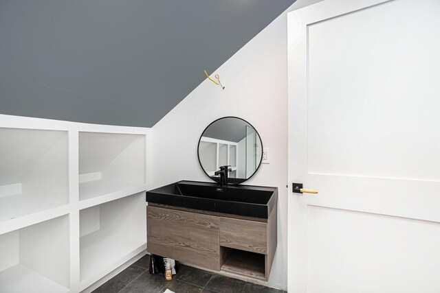 interior space featuring sink and dark tile patterned floors