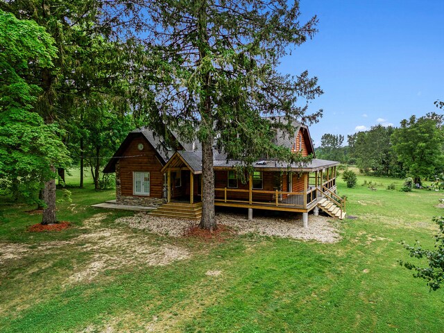 rear view of house with a lawn