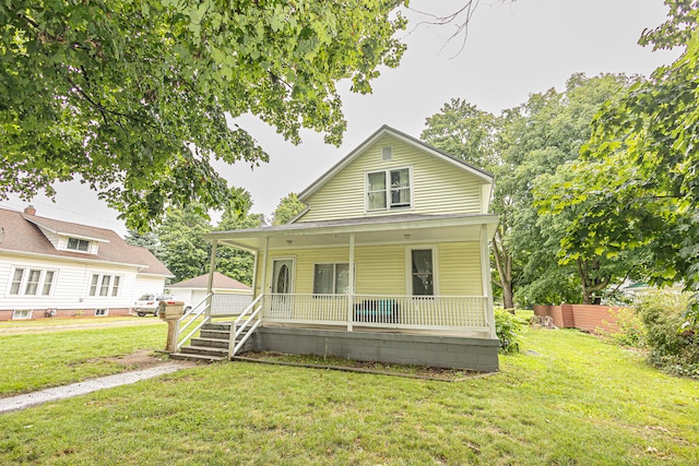 view of front of home with a front lawn and covered porch