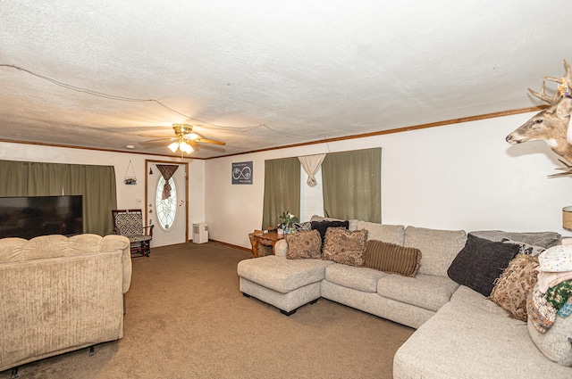 carpeted living room with ceiling fan, ornamental molding, and a textured ceiling