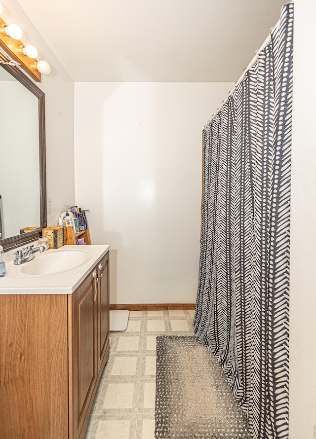 bathroom with tile patterned floors and vanity