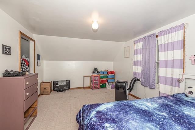 bedroom with lofted ceiling