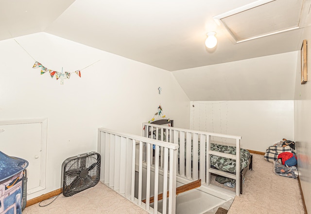 additional living space with carpet and vaulted ceiling