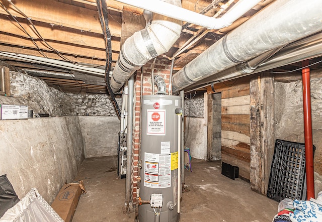 utility room featuring gas water heater