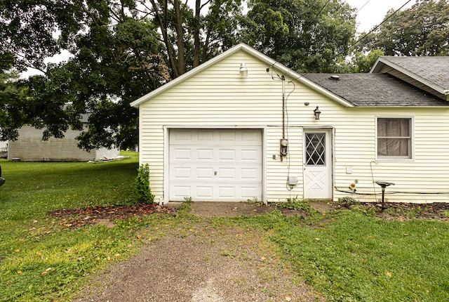 view of front of home with a garage and a front yard