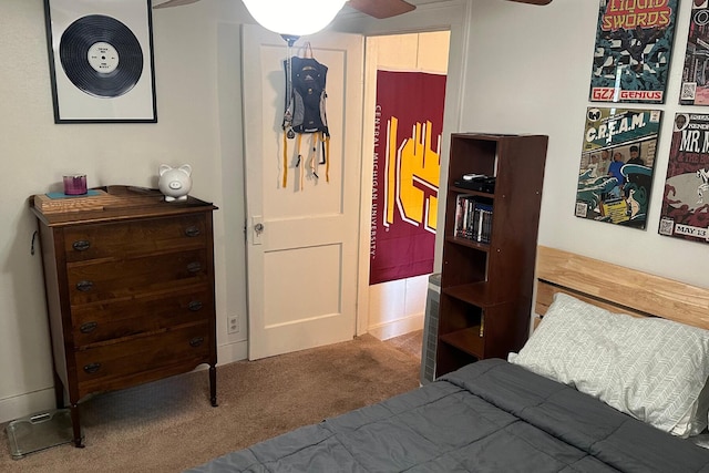 bedroom with ceiling fan and carpet flooring