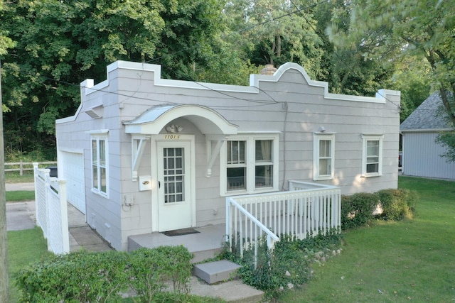 rear view of house with a yard