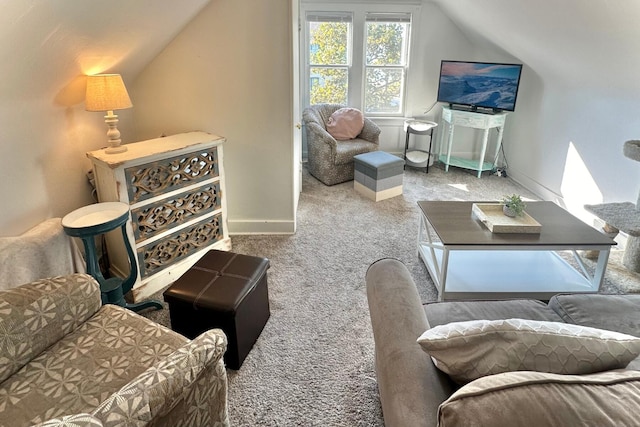 living area with lofted ceiling and light colored carpet