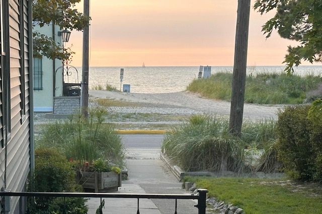 surrounding community featuring a water view