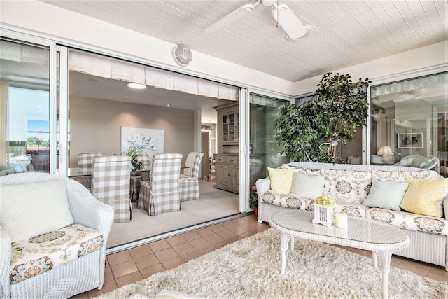 sunroom / solarium with ceiling fan and wood ceiling