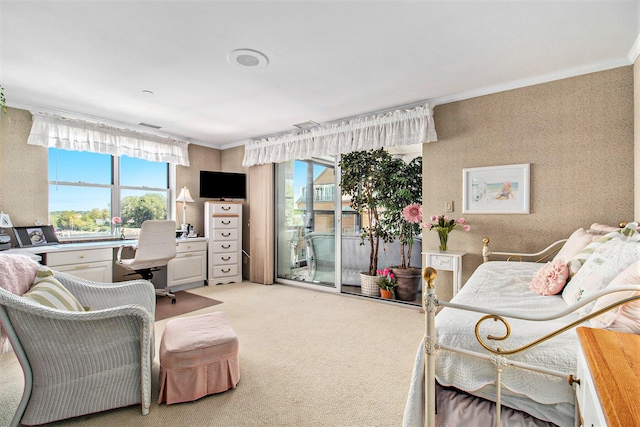 bedroom featuring crown molding, multiple windows, and light carpet