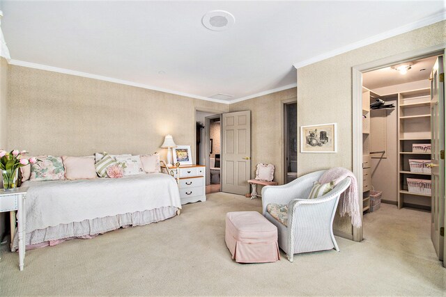 bedroom featuring a spacious closet, a closet, ornamental molding, and light carpet