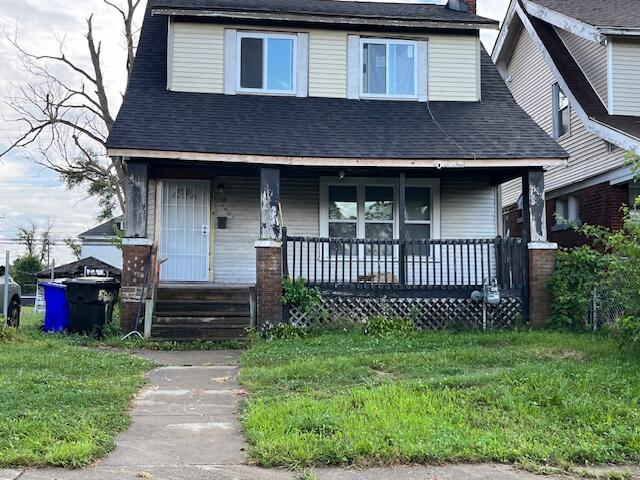 view of front of home with a front lawn and covered porch