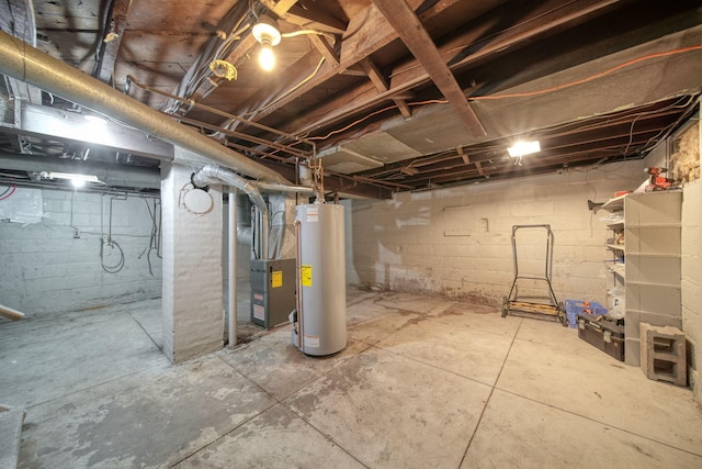 basement featuring gas water heater and heating unit