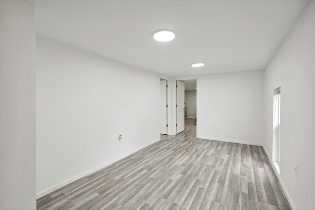 empty room featuring hardwood / wood-style flooring